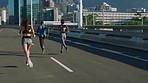 Running, fitness and people in city, back and training for health benefits, support and challenge. Friends, men and women in street, cardio workout and exercise for wellness, endurance or speed
