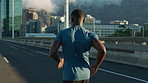 Running, training and black man in city, back and fitness for health benefits, routine or practice. Challenge, runner or person in street, cardio workout or exercise for wellness, endurance or energy