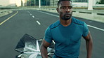 Energy, running and black man in city, parachute and training for health benefits, challenge and cardio Fitness gear, person and runner in street, resistance or exercise for wellness goals or workout