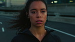 Running, training and woman in city, energy and fitness for health benefits, audio or earphones for sound. Wellness, runner or person in street, cardio workout or exercise for challenge or podcast