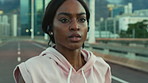 Running, training and black woman in city, energy and fitness for health benefits, speed or practice. Wellness, runner or person in street, cardio workout or exercise for challenge or routine
