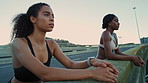 Runner, rest and women on city bridge, fitness for health benefits and breathing. Outdoor, friends or people with exercise for wellness, fatigue or break for recovery, training or workout in New York