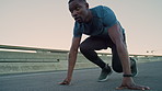Black man, runner and start with sprint in city for fitness with form, coordination and launch on bridge. African person, outdoor and training for speed, cardio and exercise for workout in urban town