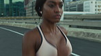 Running, training and black woman in city, routine and fitness for health benefits, energy or practice. Challenge, runner or person in street, cardio workout or exercise for endurance or wellness