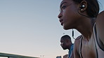 Runner, tired and people in city, fitness for health benefits and breathing with low angle. Outdoor, friends or man with woman, exercise for wellness and fatigue with training progress in New York