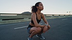 Thinking, tired and woman in city, training for health benefits and low angle with fatigue, rest or break. Exhausted, breathing or person with exercise for wellness or reflection for fitness progress