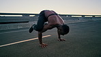 Man, handstand and push up in city for fitness with balance, strong muscle and outdoor on bridge. African person, calisthenics and heart rate monitor for wellness, exercise and flexible in urban town