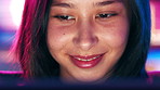 Laptop, neon and typing with happy woman online for design or web development. Computer, smile and touchscreen with designer person in office of digital agency for artistic or creative career