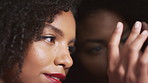 Beauty, reflection and touching with black woman in studio for cosmetics or dermatology results. Aesthetic, glass wall and skincare with African model on dark background for satisfaction or wellness