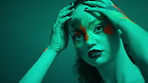Neon light, art and woman with makeup, face paint and aesthetic with transformation on background. Portrait, cosmetics and serious person with glow in studio, creative expression and touch for beauty