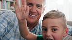 Video call, grandparent or child in house with wave, connection or online conversation in living room. POV, old man or grandchild with hello, digital communication or bonding together on virtual app.