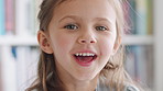 Laugh, education and face of child in library at school for development, learning or growth. Student, happy and portrait of boy kid with positive attitude for scholarship at academic campus in London