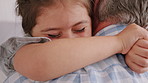 Happy, grandfather and girl in living room with hug, bonding together and support for development. Senior man, grandchild smile and embrace in house with connection, love and trust on weekend break.