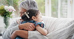 Happy, grandmother or child in house with hug, childcare or bonding together in healthy relationship. Love, old woman or grandchild with embrace, support or family connection in childhood development