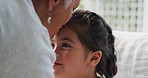 Grandma, child and kiss for care in home, trust and connection together with foster family. Kid, girl and affection with grandmother for love, bonding or support for adoption with interracial people