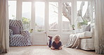 Boy, child and relax with smartphone in home on floor with online gaming, challenge or puzzle in lounge. Kid, phone and lying with click on mobile app. streaming and video subscription at house