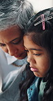 Sad, comfort and grandmother with child in home with crying for grief, loss or sympathy together. Upset, emotions and senior woman with kid for support in bad news with family care in apartment.