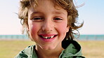 Outdoor, face and child with smile, park and relax on peaceful vacation and calm on break in nature. Happiness, portrait and adventure for boy on holiday, tourism and fresh air on weekend in Canada