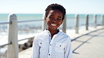 Travel, happy or black child on promenade with face, childhood holiday and fresh air on summer break. Smile, portrait or boy at beach with trip, youth vacation and outdoor getaway in New Zealand.
