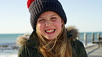 Travel, face or child at beach with laugh, childhood holiday and fresh air on weekend break. Happiness, portrait or girl on promenade with breeze, youth vacation and outdoor getaway in New Zealand.