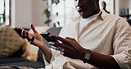 Hands, shocked and man with phone at house for scam, phishing email and fraud notification. Frustrated, male person and mobile for fake news, suspicious payment and virus warning with hacking threat