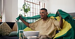 Celebrate, Brazil flag or happy man watching tv on couch, sports competition or excited for soccer game win. Live stream, football fan or cheering for tournament match success, player goal or home