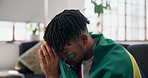 Frustrated, man and sports fan in house for watching tv, football match loss or upset for game defeat. Disappointed, person and broadcast with soccer world cup, stress and competition fail in Brazil.