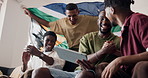 Men, friends and tablet for celebration in home on sofa for sports, goal or handshake for football match. People, group and applause for soccer game with tech, winning or South African flag in house