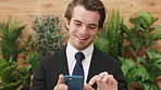 Business, smile and man in office, smartphone for social media and digital app for online humor. Person, internet and employee in workplace, mobile user and cellphone for email and message to contact
