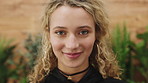 Smile, education and face of woman at university with confidence for studying, learning or knowledge. Happy, scholarship and portrait of female student at campus for college about us in London.