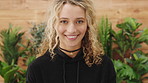 Happy, confident and face of woman in office with confidence for creative startup business. Laugh, professional and portrait of female editor with pride for company about us at agency in London.