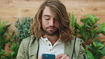 Copywriting, scroll and man in office, cellphone for social media and digital app for online reading. Person, connection or employee in workplace, typing and smartphone for email and creative agency