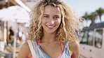 Smile, travel and face of woman in city for holiday, getaway or weekend trip in summer with relax. Happy, confident and portrait of female person on vacation with positive attitude in urban town.