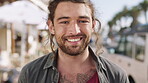 Travel, face or man in city with smile, positive attitude or summer break in urban vacation. Portrait, tourist holiday or person with happiness, good mood or town sightseeing in Los Angeles.