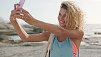 Girl, selfie and happy at beach on vacation in summer, travel and memory for post on social media. Woman, influencer and smile with photography, mobile app and content creation on seaside holiday