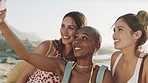 Happy woman, friends and selfie at beach on vacation in summer, travel and post on social media. Girl, group and photography for tourism by ocean with smile, diversity and memory on seaside holiday
