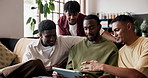 Streaming, tablet and talking with men on sofa in home living room for bonding, break or weekend. App, relax and subscription service with people in apartment together for conversation or discussion