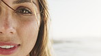 Happy, beach and face of woman with space on holiday for adventure, tourism and summer vacation outdoor. Weekend, travel and portrait of person by ocean, sea and nature for fresh air, relax and peace