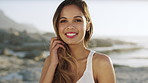 Fashion, happy and face of woman on beach for vacation, holiday and travel for sightseeing outdoor. Summer, nature and portrait of person by ocean for break, trip and relax on weekend for tourism