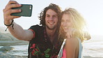 Happy couple, selfie and sunset at beach on vacation in summer, travel or hug on social media. Man, woman and smile with embrace for photography, memory and mobile app with love on holiday at seaside