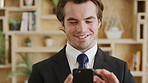 Happiness, smartphone and man in office, internet for social media and digital app for communication. Person, connection or employee in workplace, cellphone or email to download sales report or smile