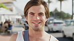 Face, tourist and man with smile on city road, summer break holiday and abroad weekend for travel trip. Portrait, confident and person with happiness for vacation, outdoor and sightseeing in Miami