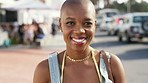 Smile, travel and face of black woman in city for holiday, getaway or weekend trip in summer with relax. Happy, confident and portrait of African person on vacation with positive attitude in town.