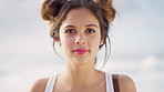Fashion, summer and face of woman on beach for vacation, holiday and travel for sightseeing outdoor. Style, nature and portrait of person by ocean for break, trip and relax on weekend for tourism