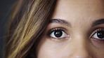 Ophthalmology, eye care and face of woman in studio with contact lenses for prescription for eyesight. Wellness, optical health and portrait of person by gray background with vision or optometry test