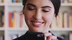 Smile, thinking and woman in library, smartphone for social media and email for positive results. University student, academy and person with cellphone for online chatting, idea or message to contact