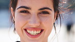 Smile, confident and face of woman outdoor with wind for vacation, getaway or weekend trip. Travel, happy and portrait of female person with positive attitude for breeze in hair on holiday in Canada.
