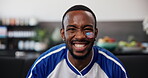 Watching, face and football fan in house with victory, goal excitement or celebration in sports tournament. POV, soccer game or black man with fist pump, score lead and winning shout in Los Angeles.