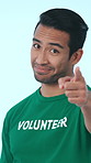 Face, man and volunteer pointing in studio for recruitment, invitation and social responsibility. Portrait, person and heart gesture for participation, join us and call to action on white background