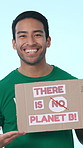 Poster, volunteer and face of man in studio for awareness on global warming, climate change or sustainability. Charity, portrait and person with sign for recycle, waste or activism on blue background